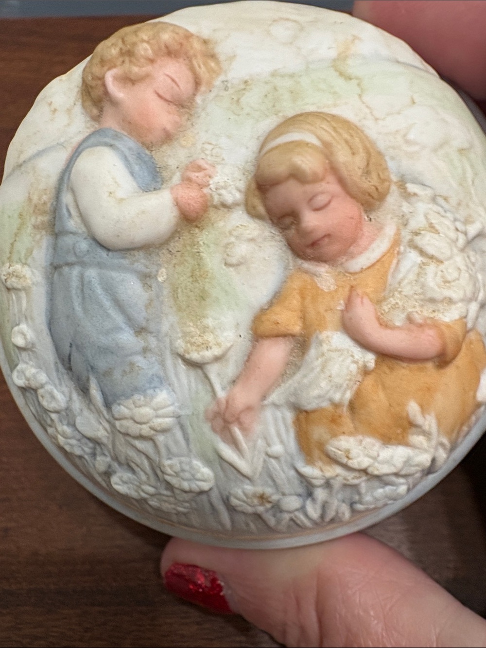 a vintage 1985 Avon "Golden Dreams" Porcelain Musical Trinket Box.